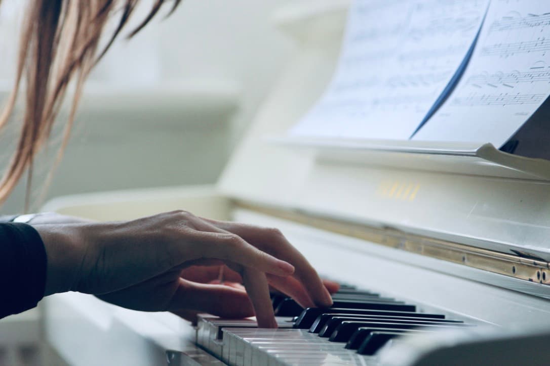 Piano hands close-up — teaching technique